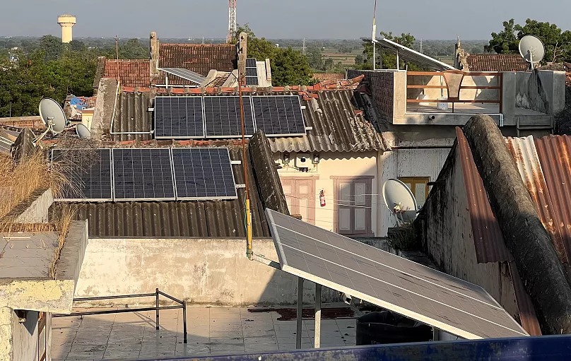 Rooftop solar panels on homes in a village in India